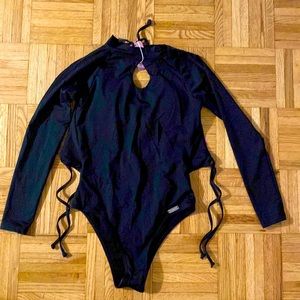 Black bathing suit size small . NWT